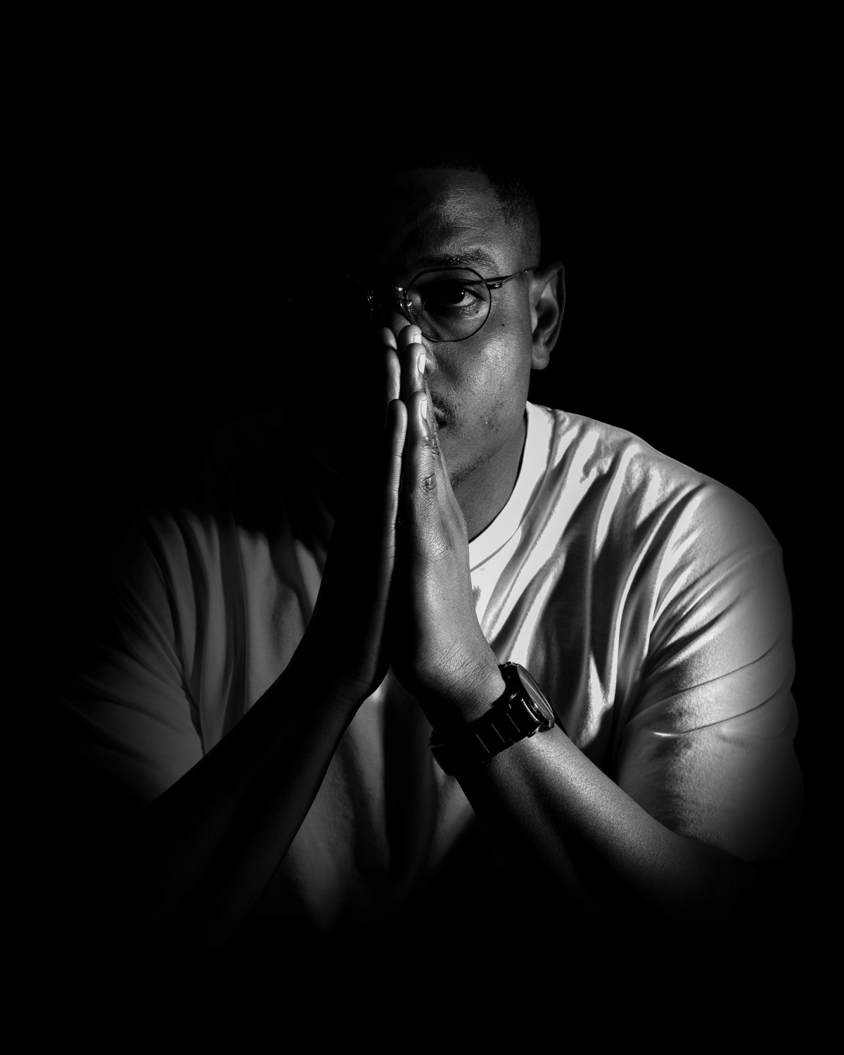 DJ Neizer, black and white portrait, hands pressed together